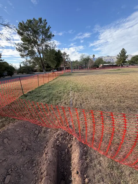 Fenced irrigation trench