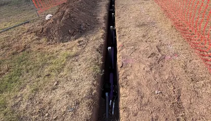 Irrigation mainline pipe in a long open trench